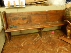 A stained oak pew,