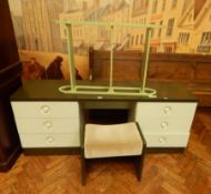 A modern dressing table fitted with two pedestals with three drawers,