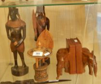 A tribal art carved wood model well with hatched carving, two tribal warriors (possibly Masai),