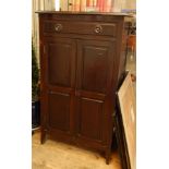 An Edwardian mahogany sheet music cabinet with one drawer above panelled cupboard doors,