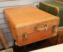 Early to mid 20th century leather suitcase of asymmetric opening with brass corners and catches,