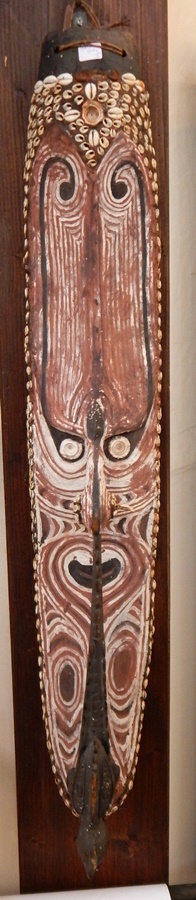 An African tribal mask with shell decoration, glass inkwells,