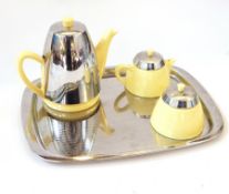 Mid 20th century Heatmaster yellow pottery and chromium plated metal three-piece tea service on