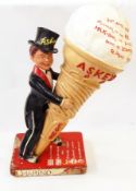 An Askeys advertising figure with a gentleman in top and tails holding a large ice cream cone,