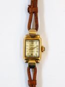 Lady's Rotary 9ct gold wristwatch in rectangular case with raised arch glass face