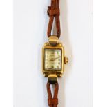 Lady's Rotary 9ct gold wristwatch in rectangular case with raised arch glass face