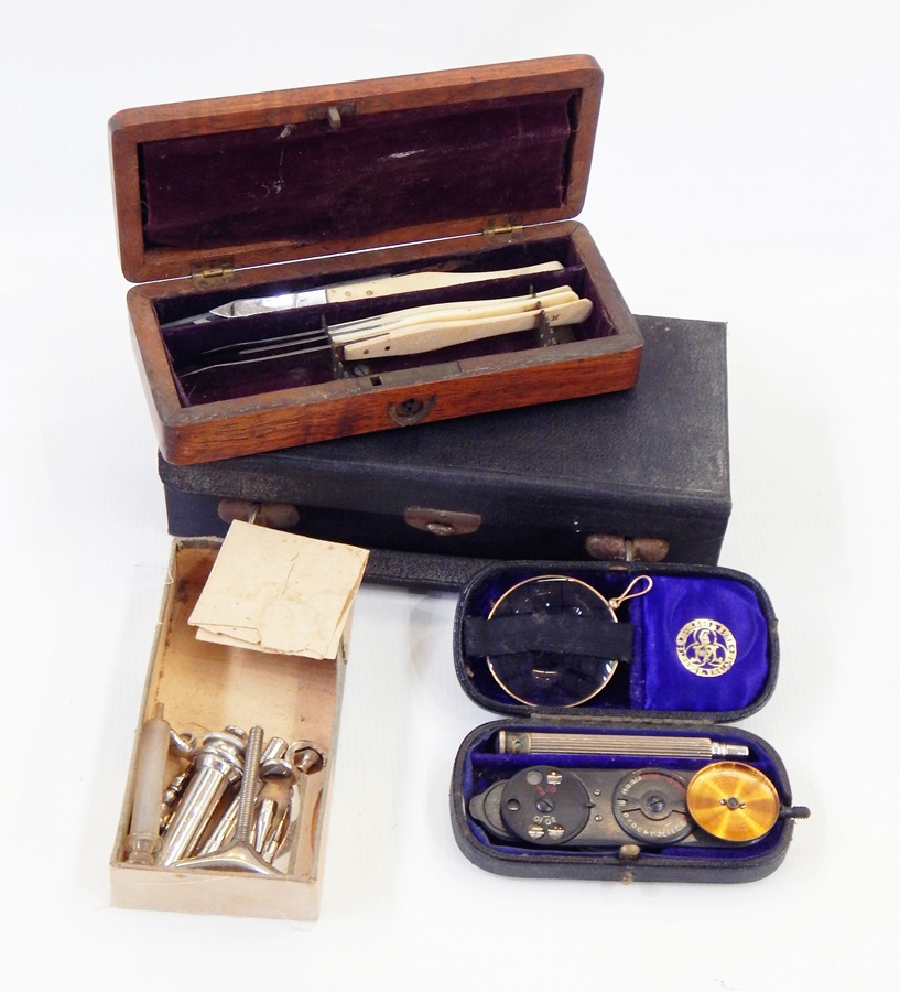 A quantity of medical and scientific equipment including a set of bone-handled scalpels,