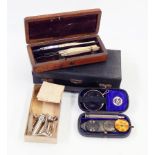 A quantity of medical and scientific equipment including a set of bone-handled scalpels,