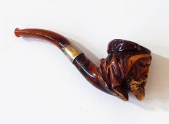 A meerschaum amber pipe with silver mounts, in the shape of an Arabic man,