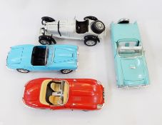 A Burago model of a Jaguar E-type 1961, 1:18 scale, another of a 1955 spider,