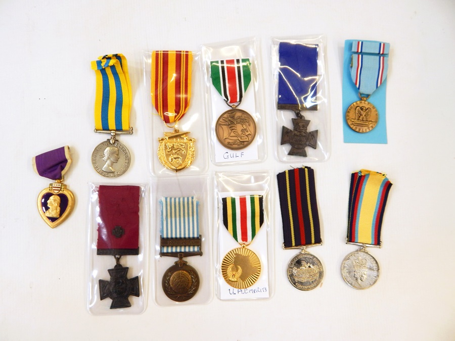 Eleven reproduction medals together,