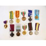 Eleven reproduction medals together,