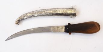 Arabic rhino horn handled knife with foreign silver scabbard, floral and scroll decoration,