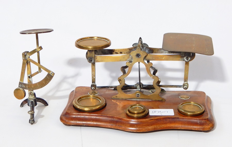 Pair of brass postal scales with weights,