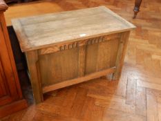 A 20th century oak coffer on block supports,