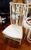 A white stickback kitchen chair and a pair of bentwood painted white chairs