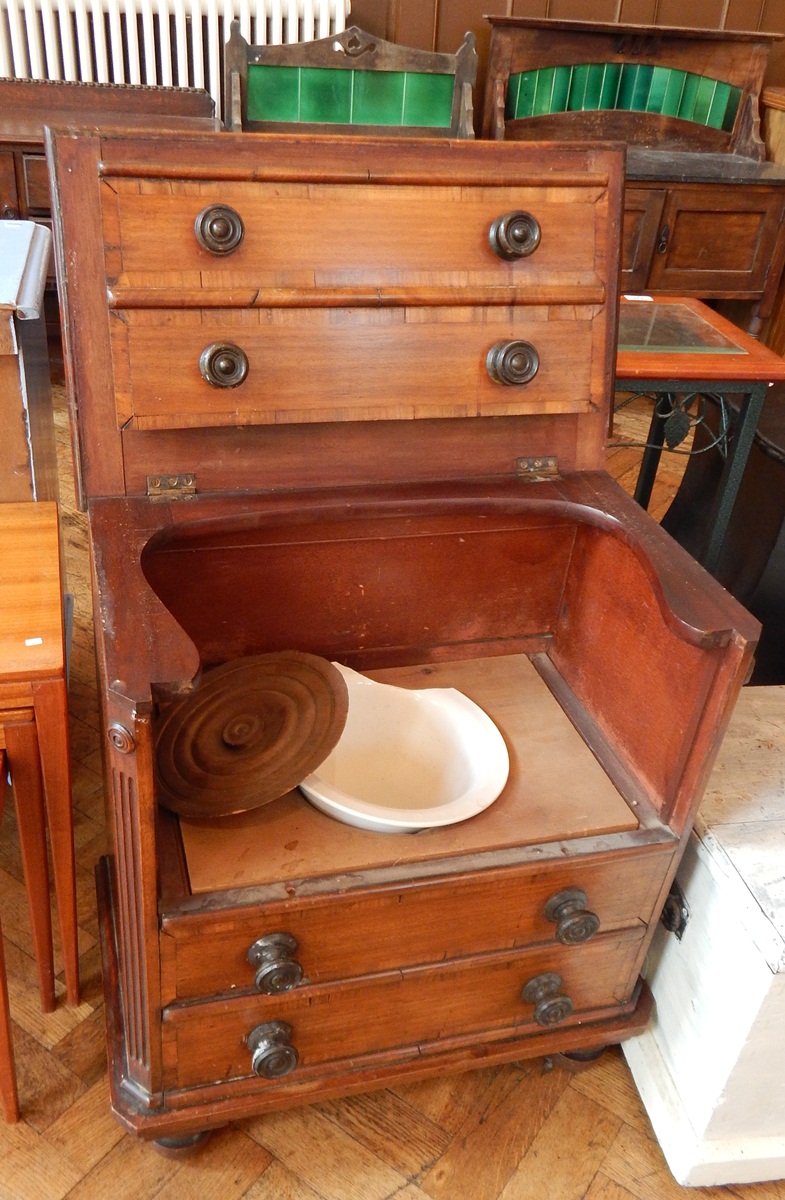 A 19th century commode with turned bun handles, on bun feet,