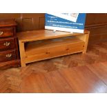 A 20th century inlaid oak low sideboard with undershelf and three short drawers, on block supports,