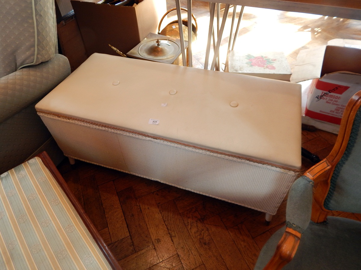 A Lloyd Loom style blanket box painted white,