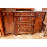 A breakfront mahogany sideboard with two flanking drawers and cupboards,