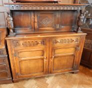 Reproduction court cupboard with cup and cover supports and floral carving,