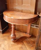 A mahogany console table with tapered spirally twisted legs and reeded supports,