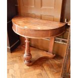 A mahogany console table with tapered spirally twisted legs and reeded supports,