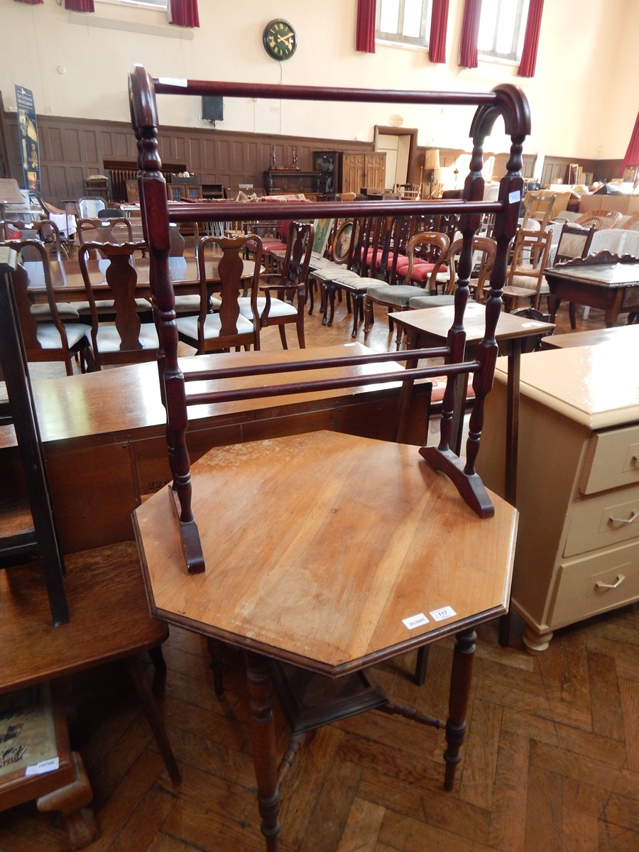 A walnut octagonal top table on bobbin and tapering supports, united by cross stretcher,