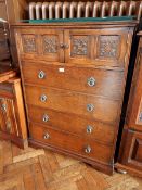 A chest of three drawers and cupboard to top, circular handles, on shaped bracket feet,