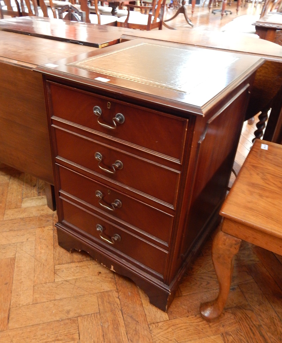 A reproduction two drawer filing cabinet with four drawer frontage,