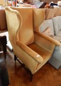 A wing back armchair upholstered in dralon