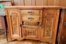 A Victorian walnut breakfront sideboard with two flanking cupboards and two drawers and under