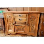 A Victorian walnut breakfront sideboard with two flanking cupboards and two drawers and under