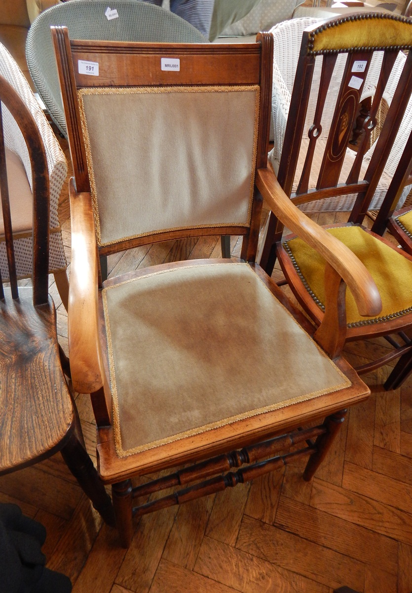 Stained wood open armchair having upholstered back and seat,