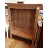 A pine open bookcase with carved dragons and floral carving, two short and two long drawers to base,