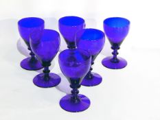 A set of six 19th c Bristol blue wine glasses with knop stems