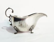 A George V silver teapot of plain oval form, with carved wooden handle, Birmingham 1916,