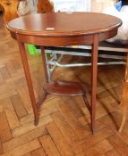 An oval-shaped occasional table with stringing to edge, cabriole legs and under-tray,