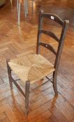 Two ladderback chairs with rush seats,