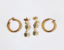 A pair of gold drop earrings set with oval mixed cut aquamarines in collet settings (topaz