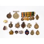 A collection of nine silver fobs including a Victorian example, two enamel examples,