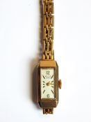 Lady's Avia 9ct gold wristwatch with rectangular dial and gate-pattern bracelet strap, approx.