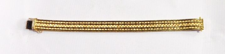 A 18ct gold flexible bracelet, bark-finish rows of links with herringbone borders, 48g approx.
