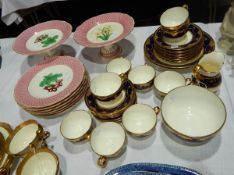A Minton china part tea service with tooled and jewelled gilt borders,