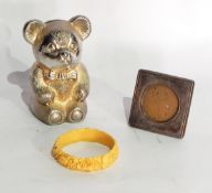 A small silver photograph frame, miniature brass items,