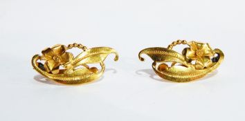 A pair of gold-coloured metal floral and foliate scroll earrings,