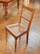 A pair of bedroom chairs with cane seats,