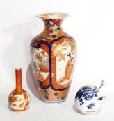 A Japanese Imari porcelain vase, ovoid and tapering with mother and child in scalloped panels,