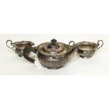 A silver three-piece bachelor's teaset by William Hutton & Sons Limited,