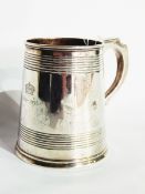 A George V silver pint mug, of reeded tapering cylindrical form, Birmingham 1934, 14oz approx.